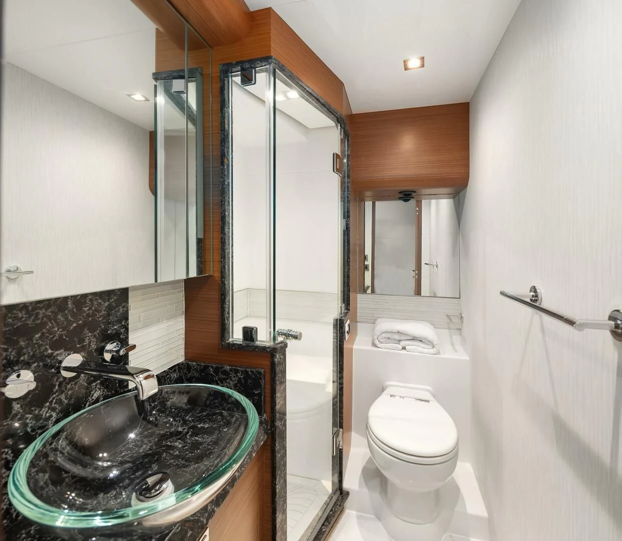 a bathroom with a glass shower aboard PLAYBOOK Yacht for Sale