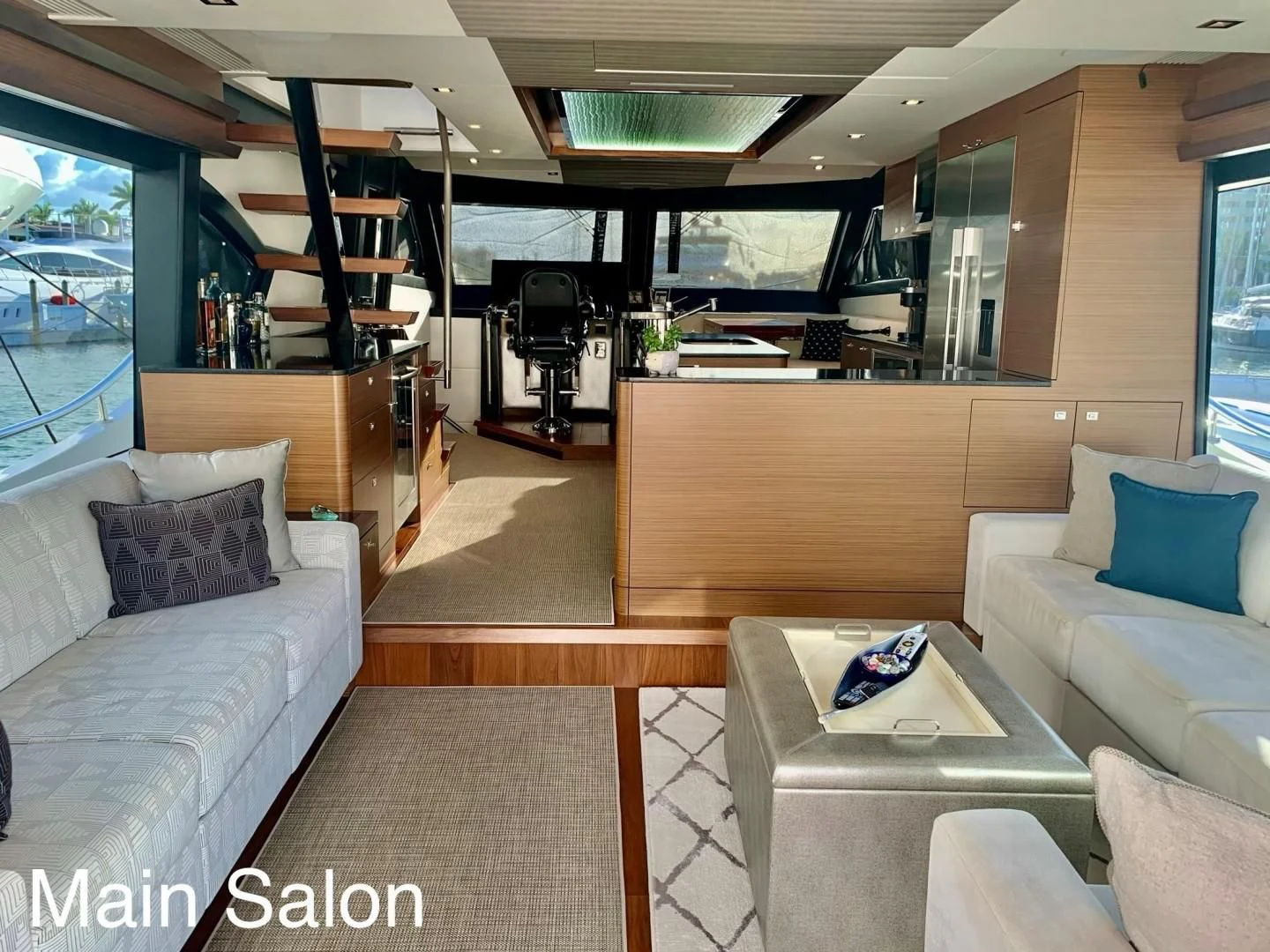 a room with a couch and a table aboard PLAYBOOK Yacht for Sale