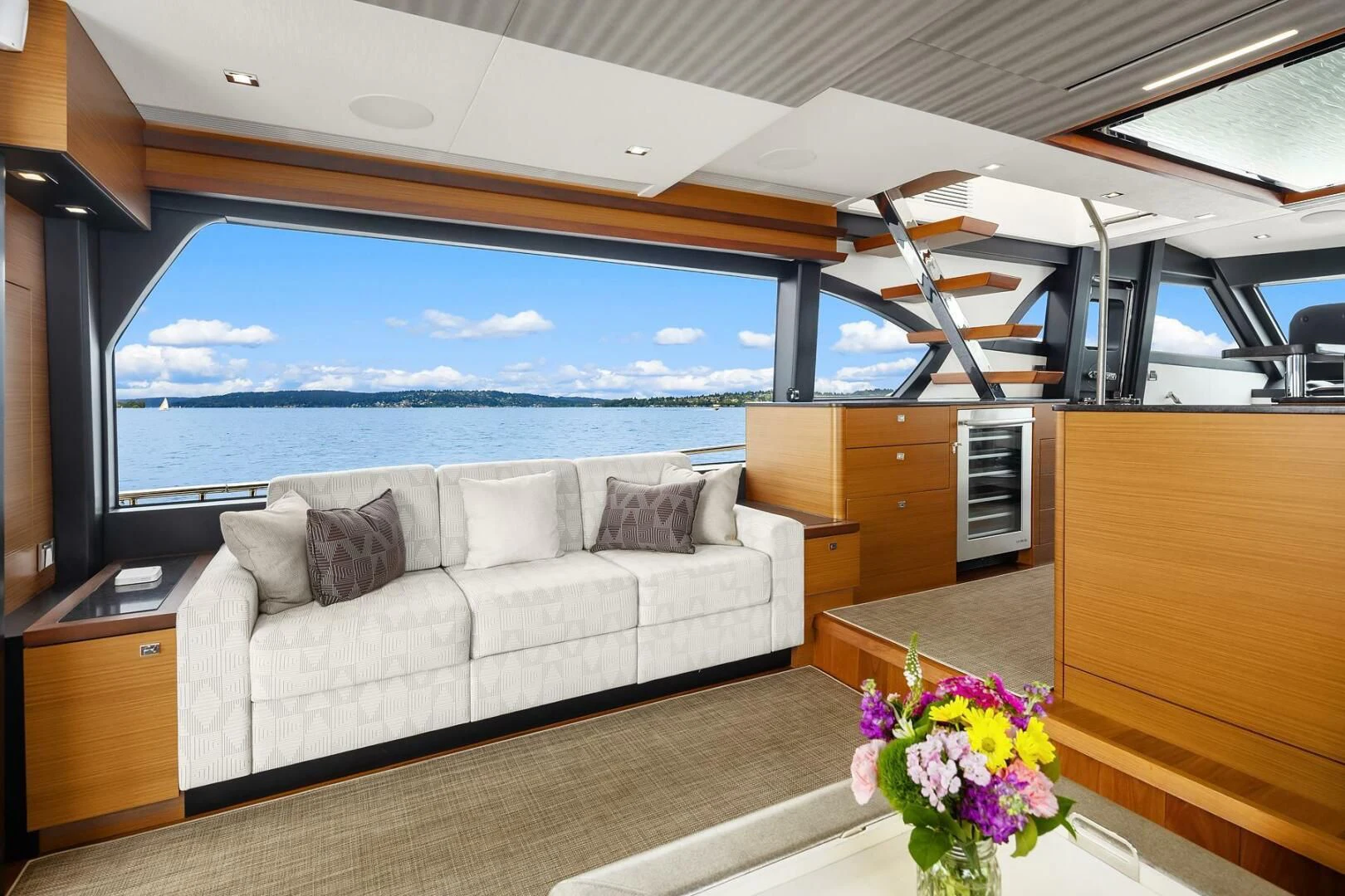 a living room with a large window aboard PLAYBOOK Yacht for Sale