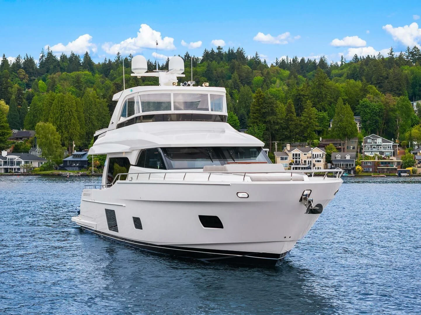 a white boat on the water aboard PLAYBOOK Yacht for Sale