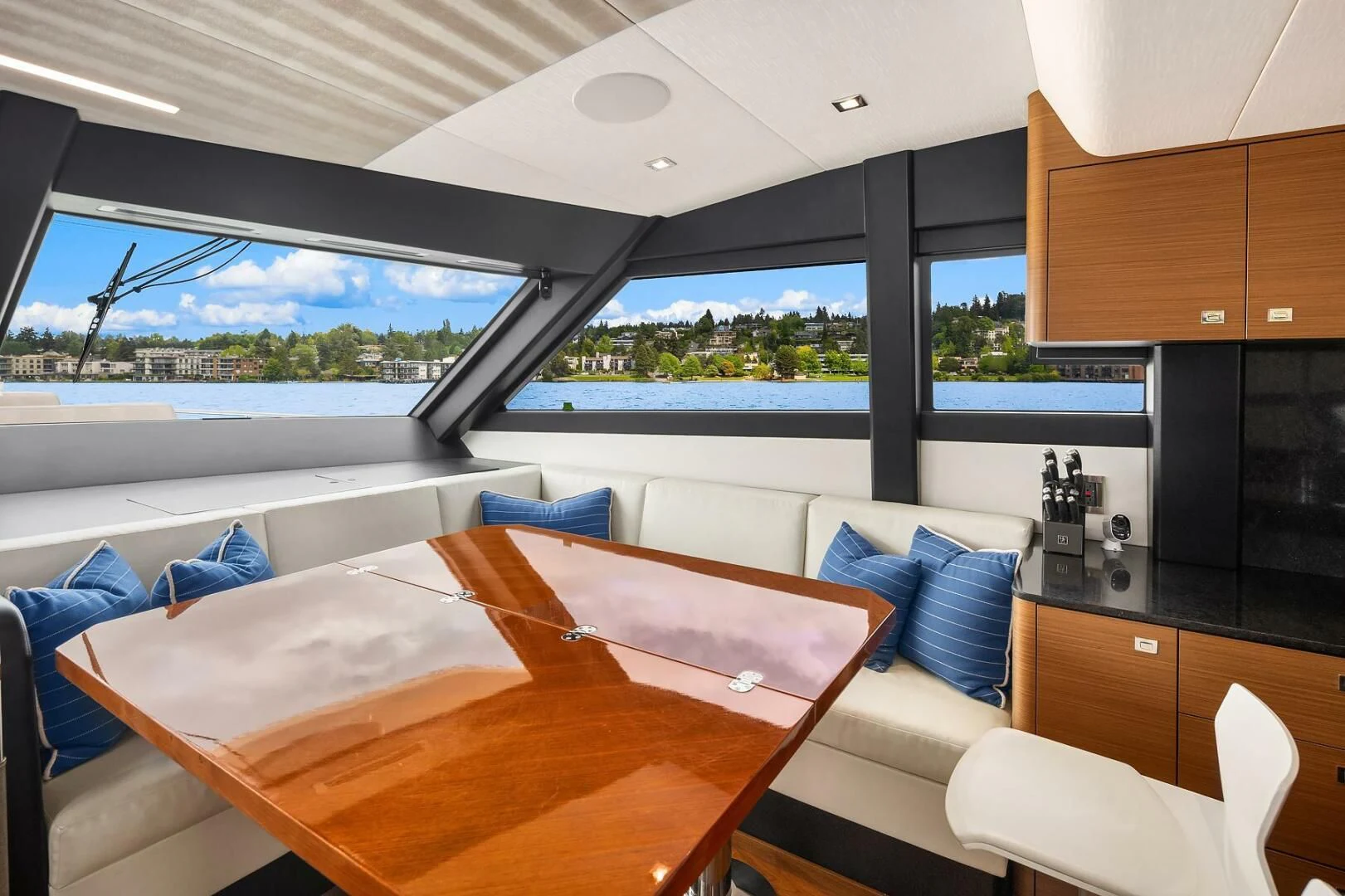 a room with a table and chairs aboard PLAYBOOK Yacht for Sale