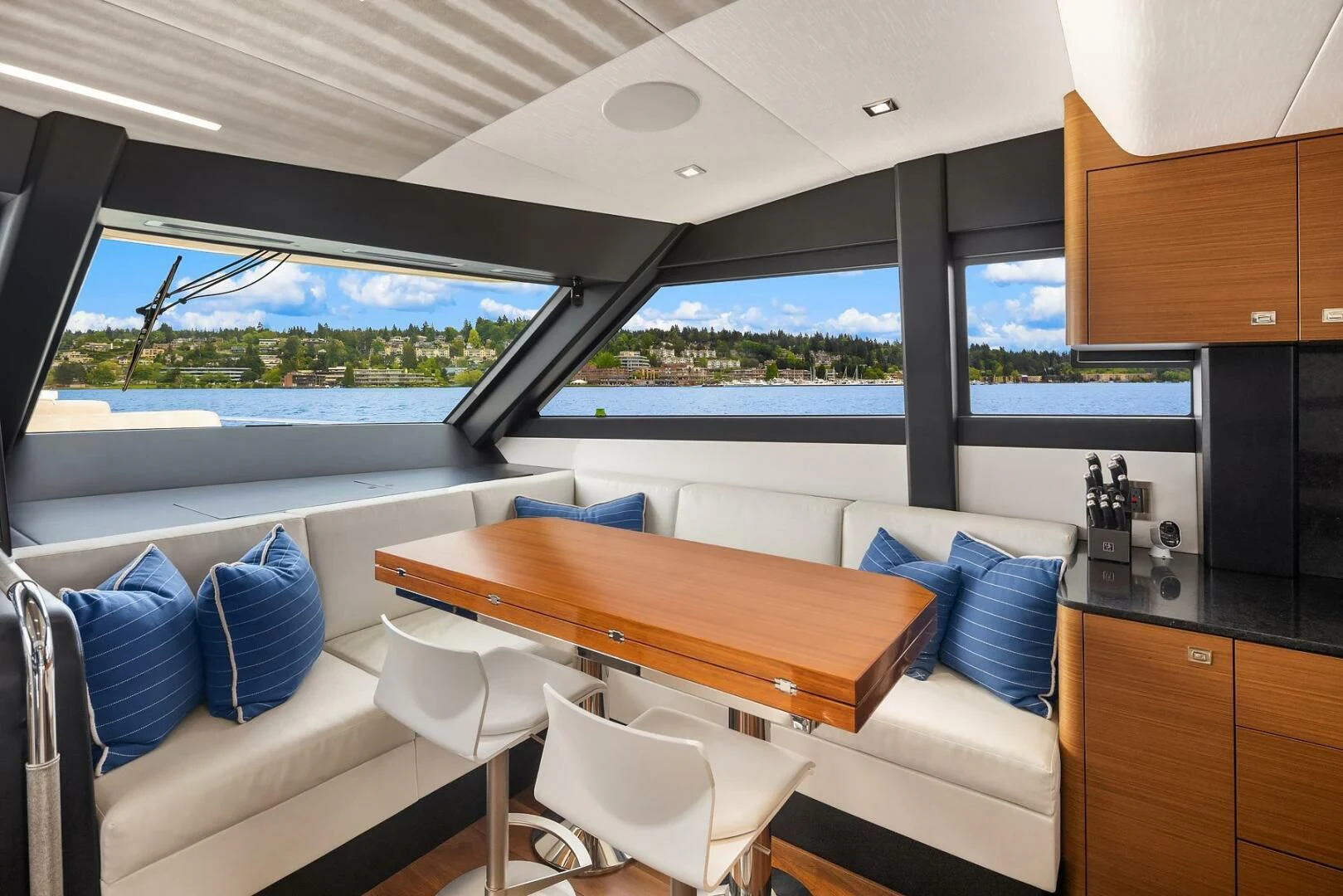 a room with a table and chairs aboard PLAYBOOK Yacht for Sale