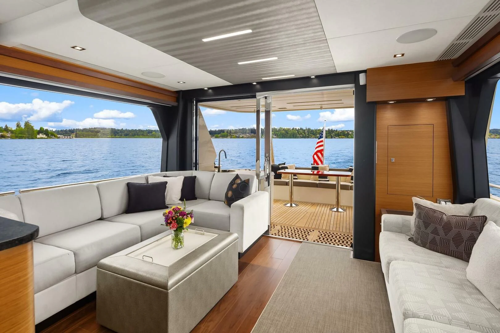 a living room with a large window aboard PLAYBOOK Yacht for Sale