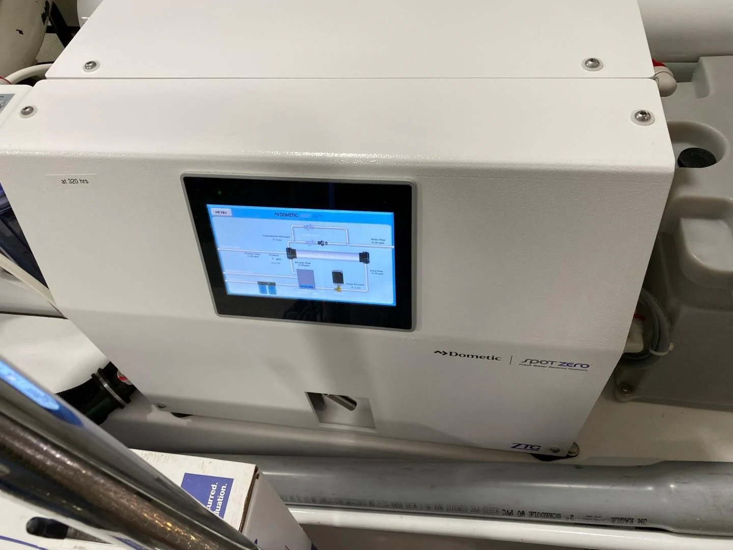 a white electronic device aboard PLAYBOOK Yacht for Sale