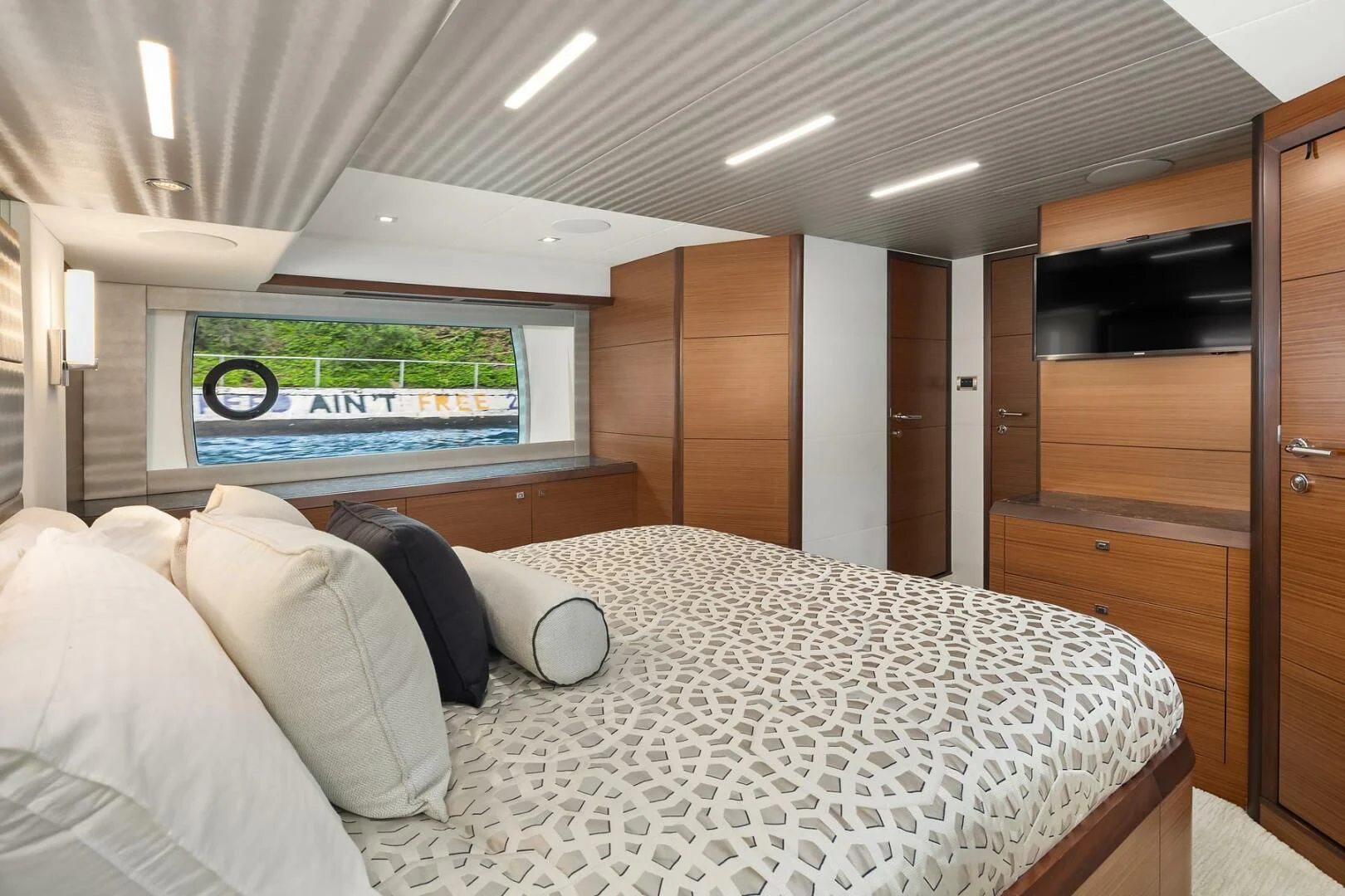 a bed in a room aboard PLAYBOOK Yacht for Sale