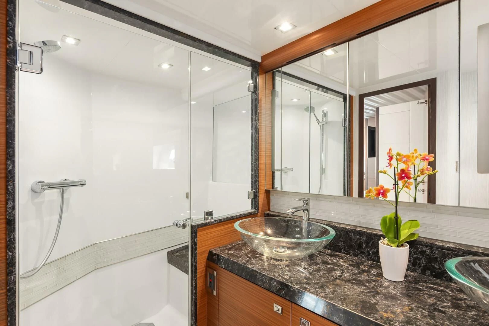 a bathroom with a sink and a bathtub aboard PLAYBOOK Yacht for Sale