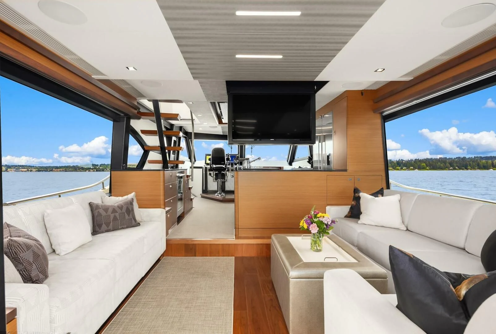 a living room with a large window aboard PLAYBOOK Yacht for Sale