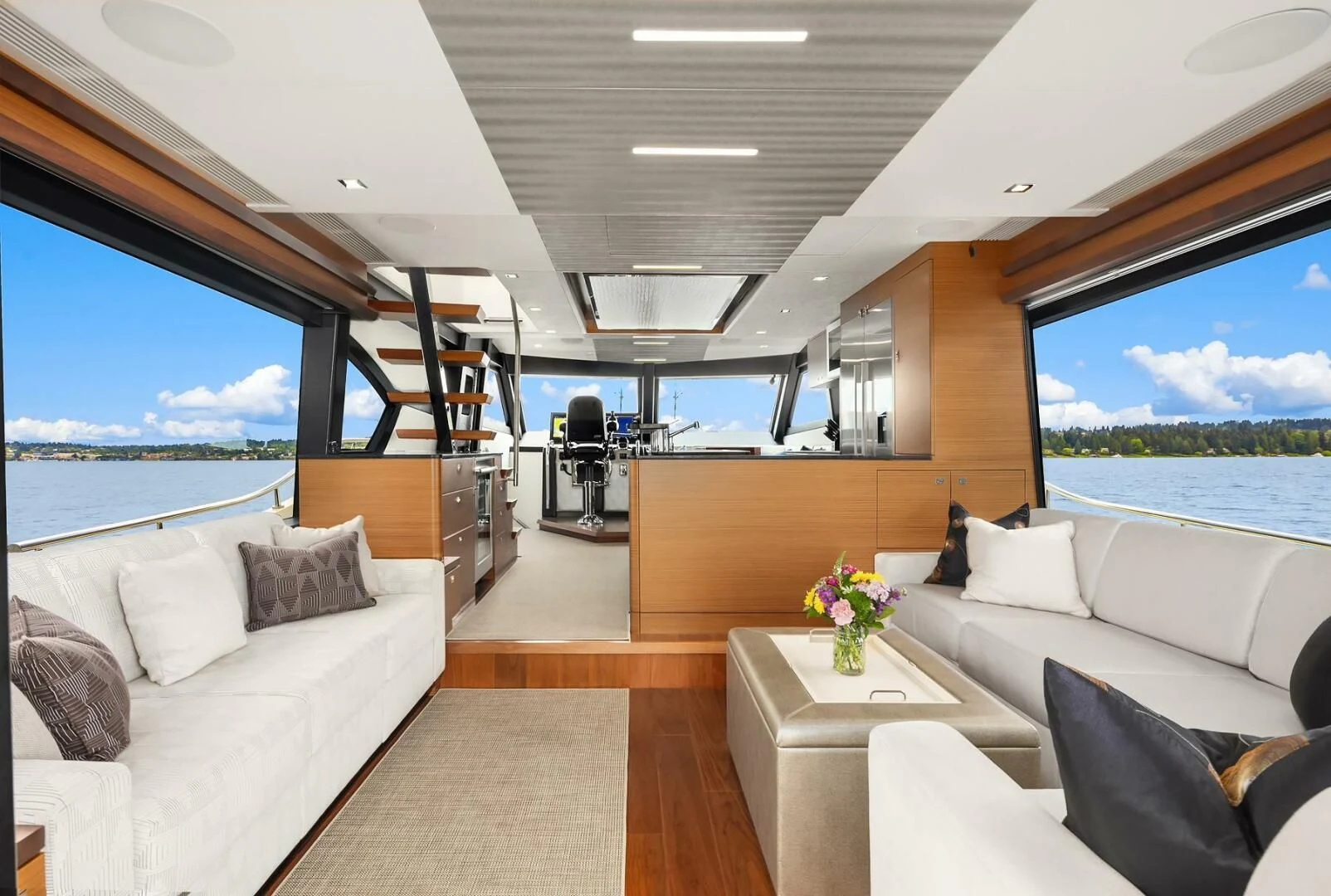 a room with a large window and a view of the ocean aboard PLAYBOOK Yacht for Sale