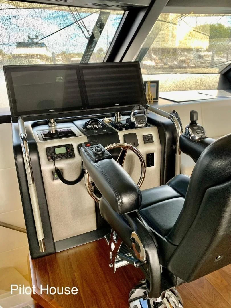 a vehicle with a tv and a seat aboard PLAYBOOK Yacht for Sale