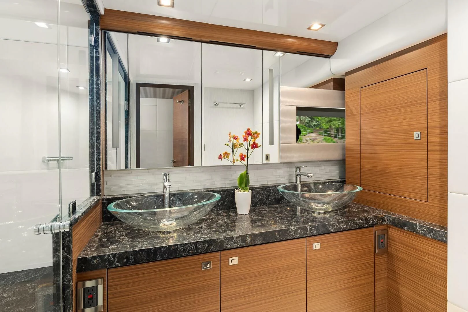 a bathroom with a sink and a mirror aboard PLAYBOOK Yacht for Sale
