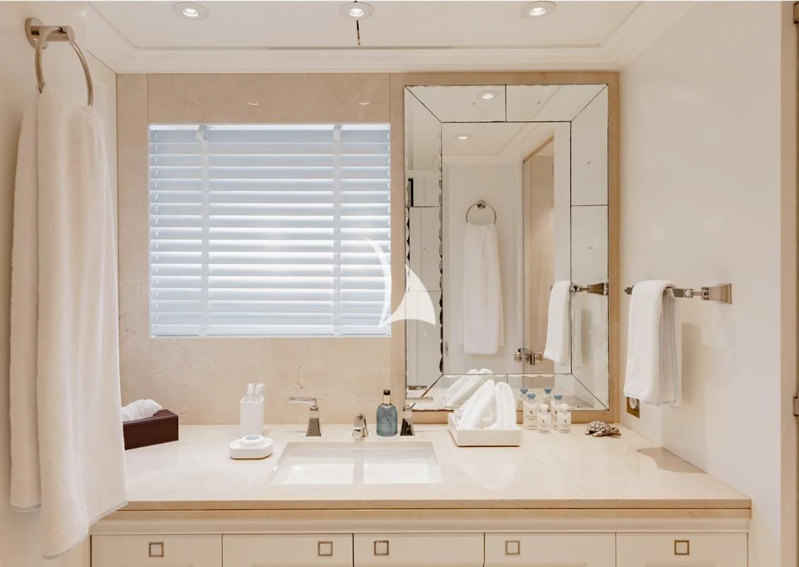 a bathroom with a large mirror aboard IDEFIX II Yacht for Charter