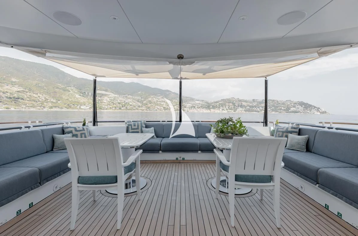 a large living room with a large window aboard IDEFIX II Yacht for Charter