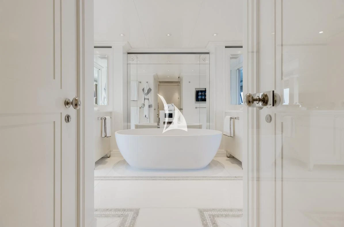 a white bathroom with a sink aboard IDEFIX II Yacht for Charter