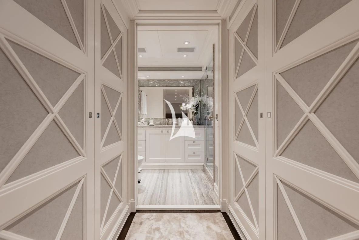 a hallway with white doors aboard IDEFIX II Yacht for Charter