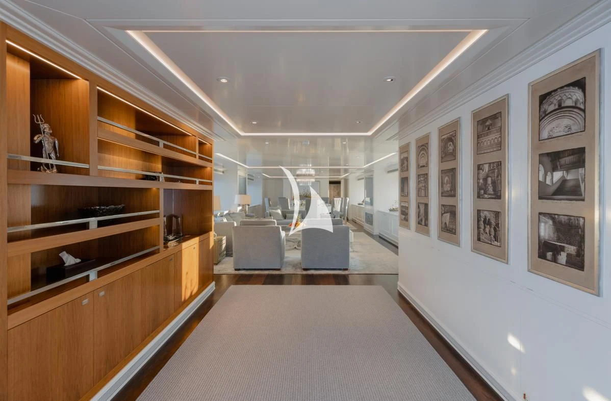 a room with a couch and a bookcase aboard IDEFIX II Yacht for Charter