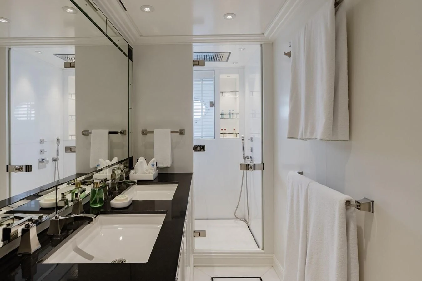 a bathroom with a sink and a mirror aboard IDEFIX II Yacht for Charter