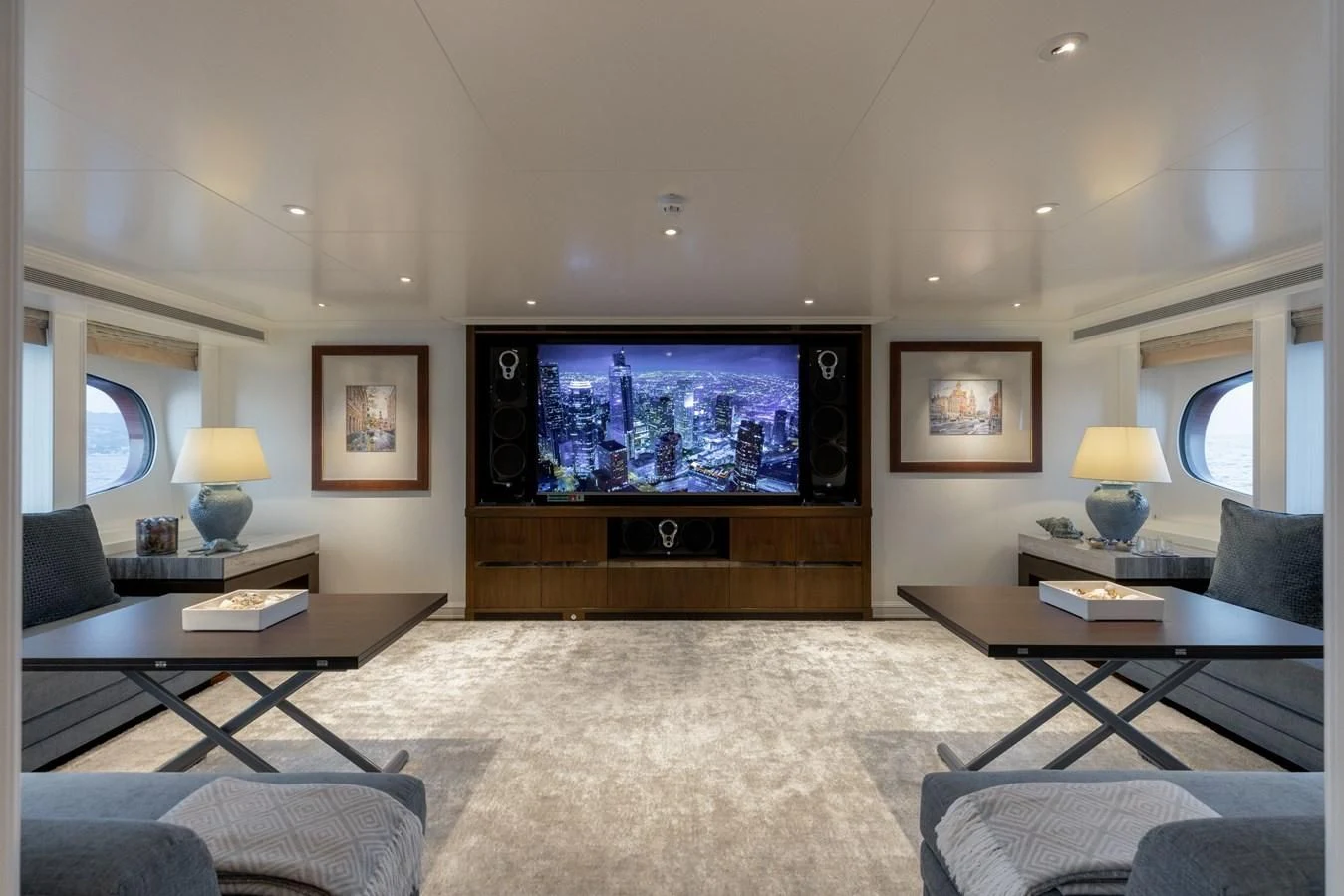 a living room with a large television aboard IDEFIX II Yacht for Charter