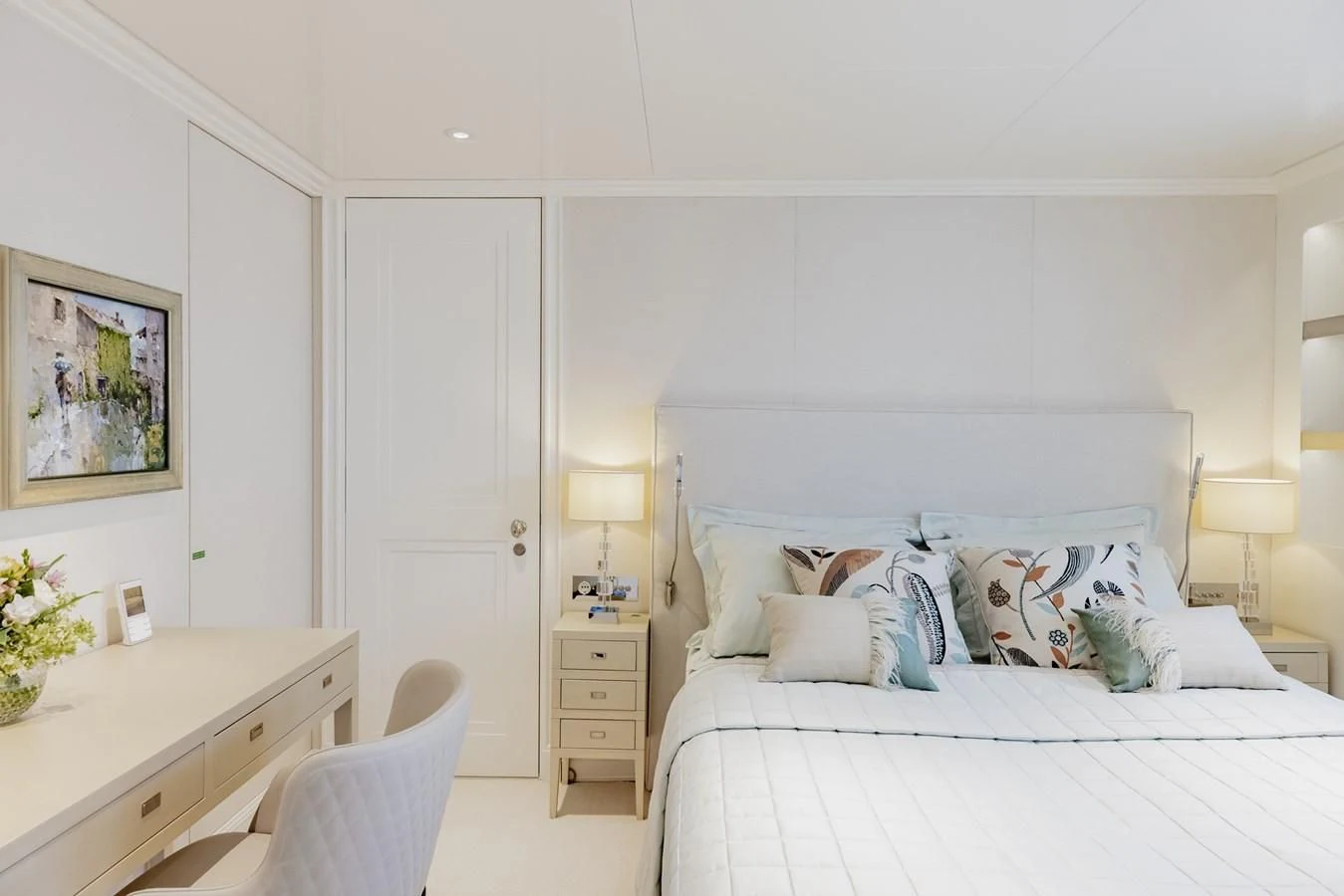 a bedroom with a bed and a desk aboard IDEFIX II Yacht for Charter