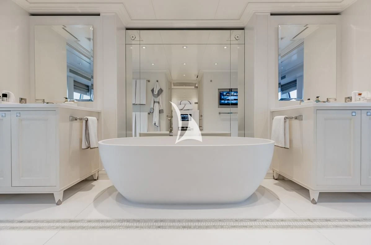 a white bathroom with a large white tub aboard IDEFIX II Yacht for Charter