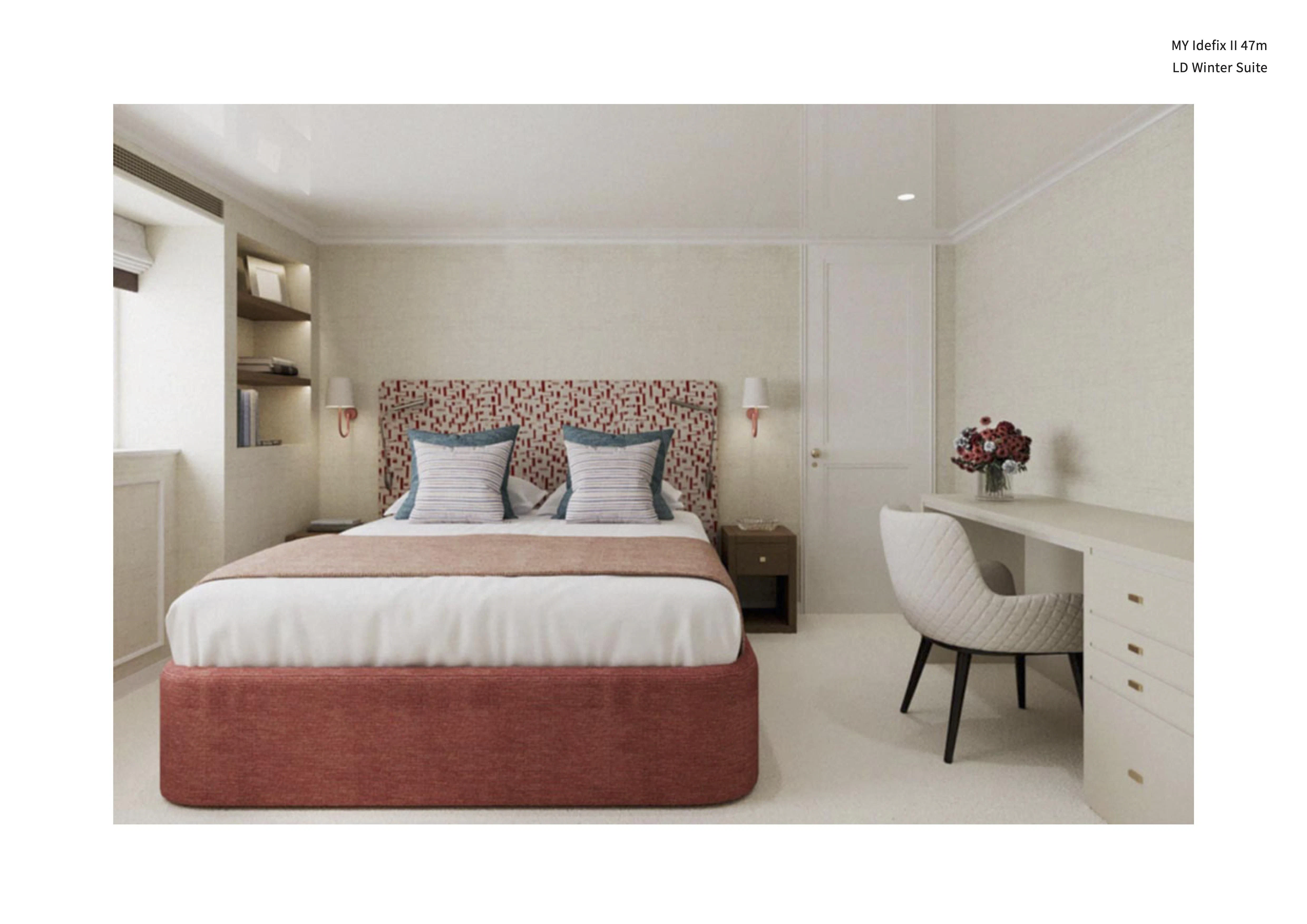 a bed with a pink comforter aboard IDEFIX II Yacht for Charter