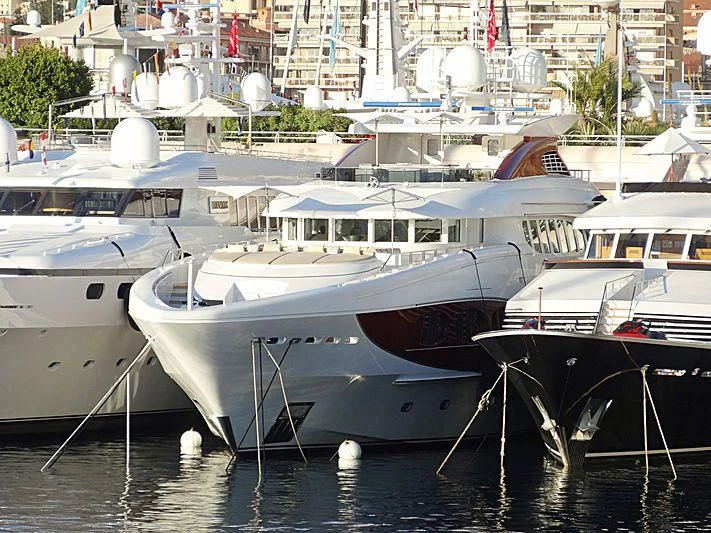 several boats are parked in a harbor aboard IDEFIX II Yacht for Charter
