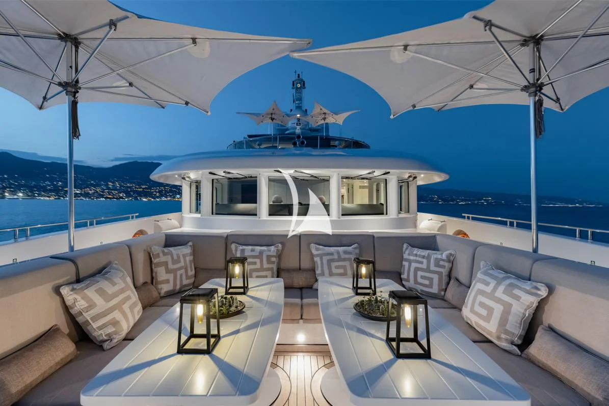 a room with a couch and chairs aboard IDEFIX II Yacht for Charter