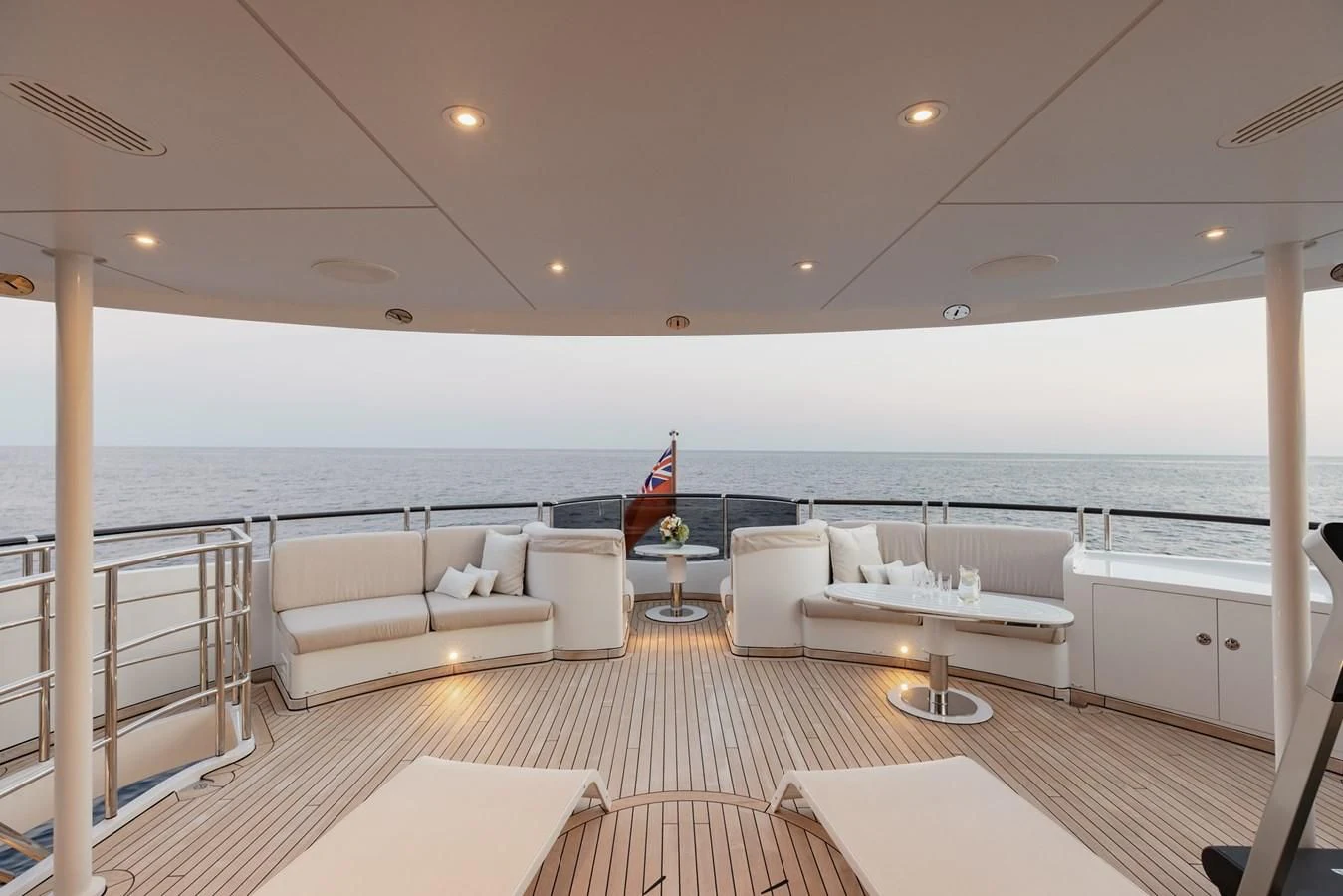 a large living room with a large balcony overlooking the ocean aboard IDEFIX II Yacht for Charter