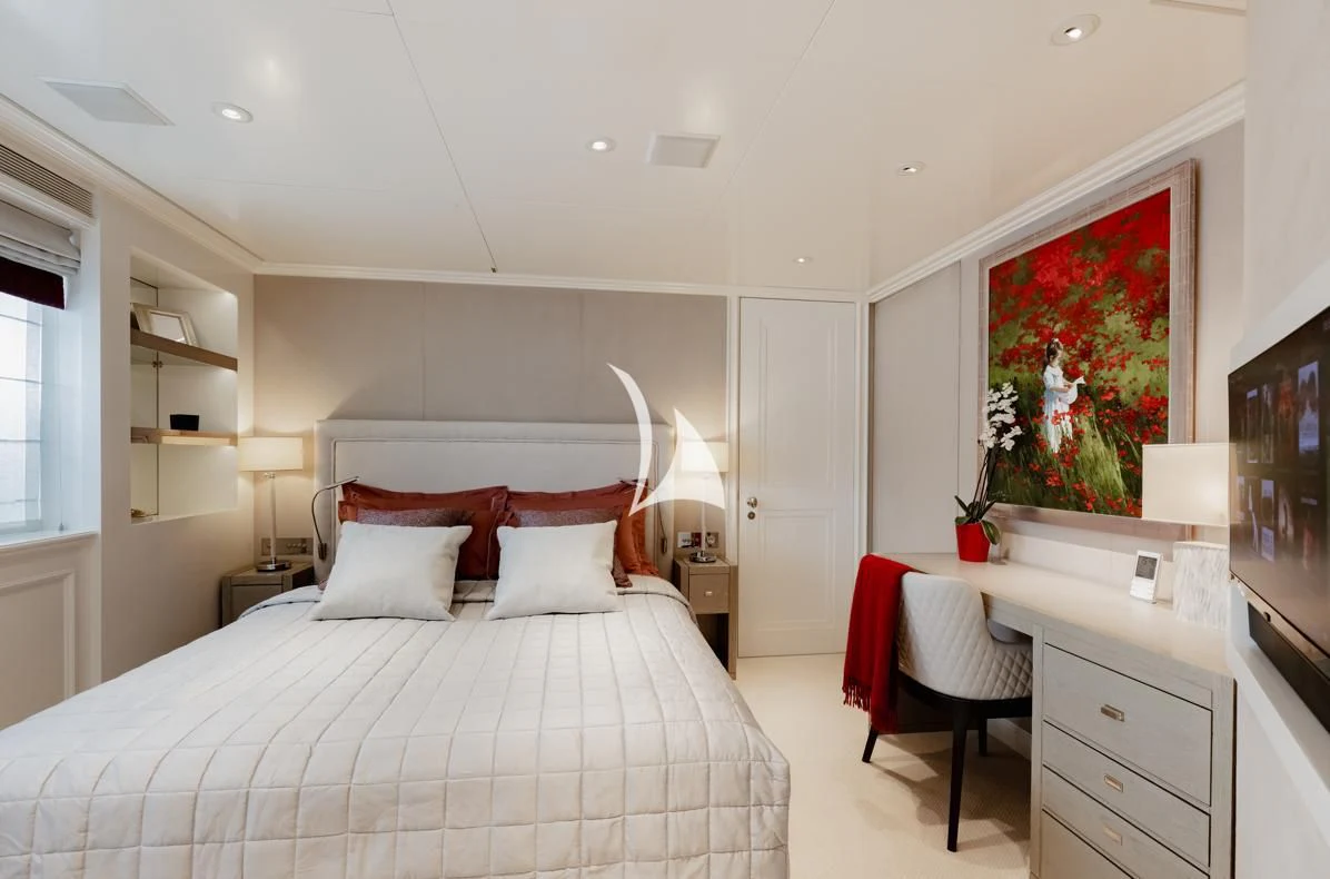 a bedroom with a large bed aboard IDEFIX II Yacht for Charter