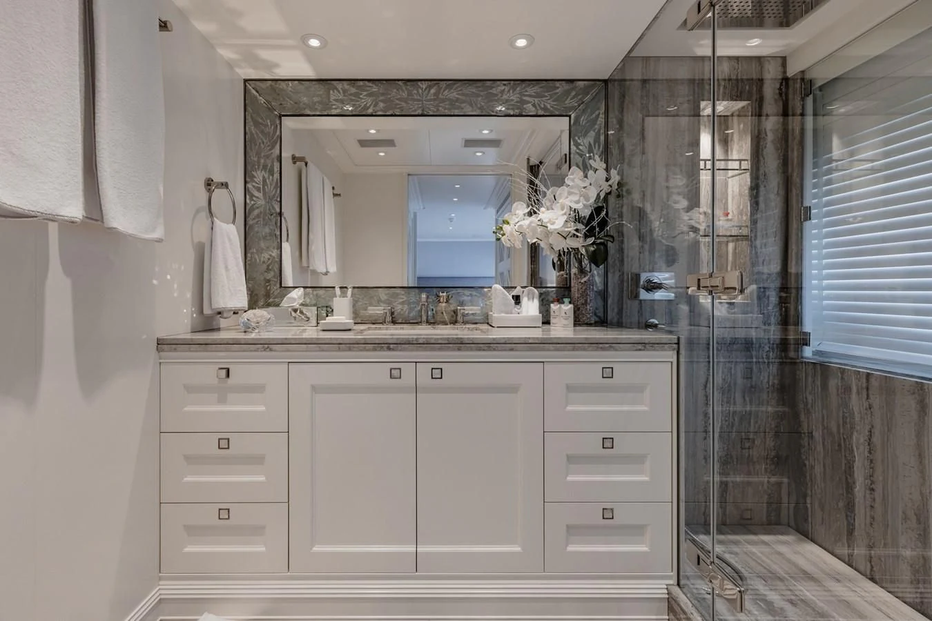 a bathroom with a sink and a mirror aboard IDEFIX II Yacht for Charter