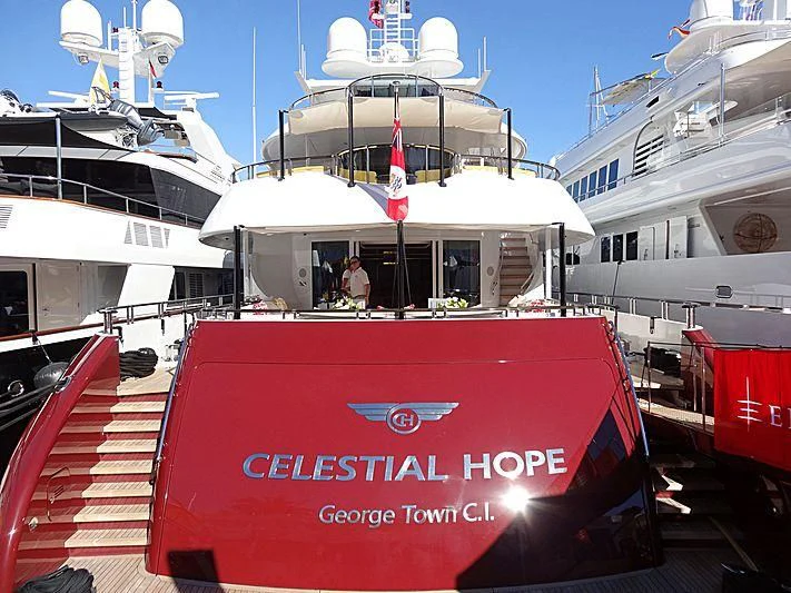 a boat with a flag on the front aboard IDEFIX II Yacht for Charter