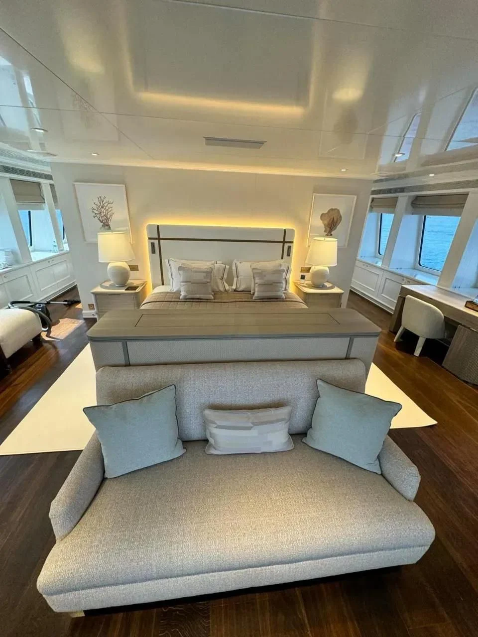 a bed with a couch aboard IDEFIX II Yacht for Charter