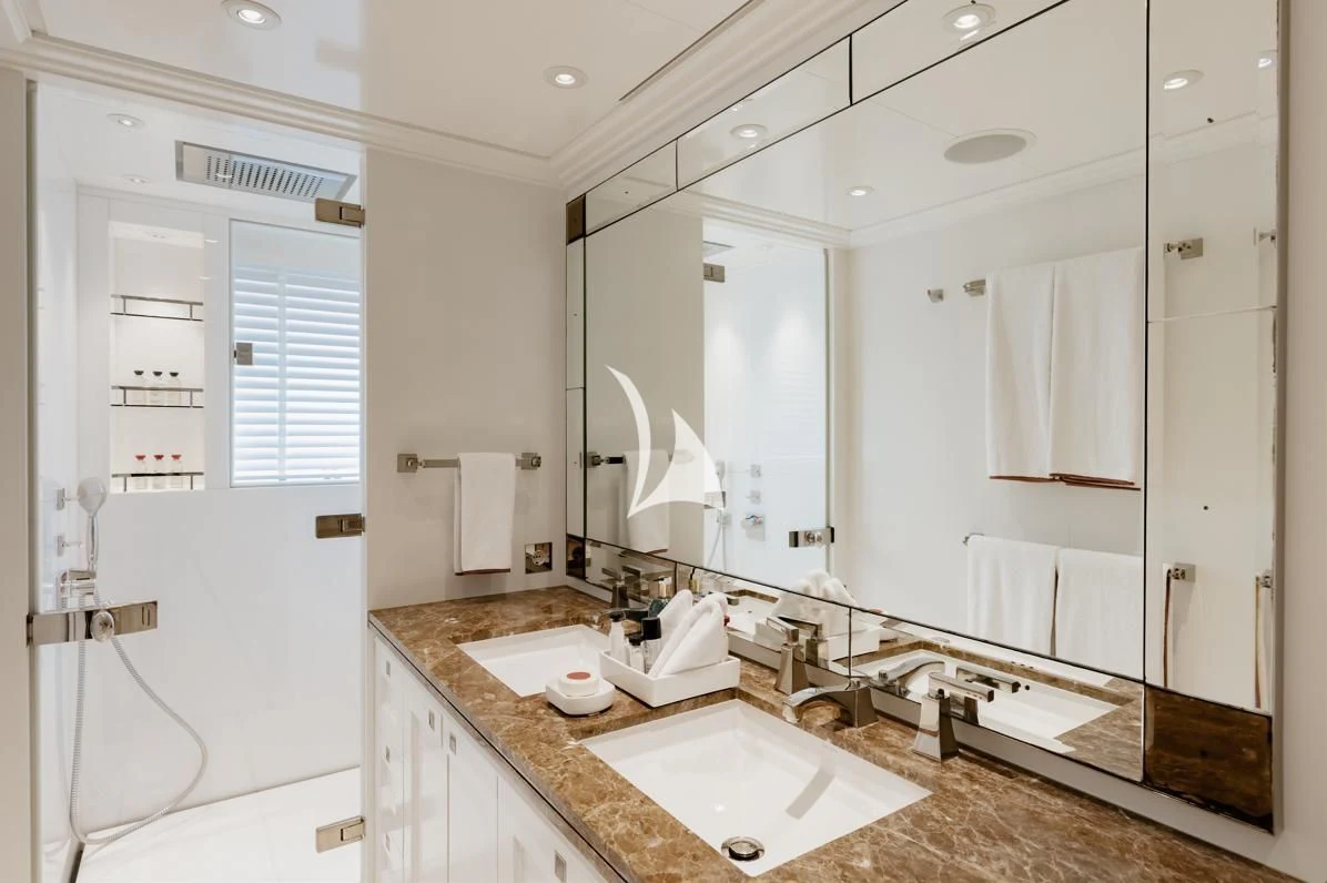 a bathroom with a large mirror aboard IDEFIX II Yacht for Charter