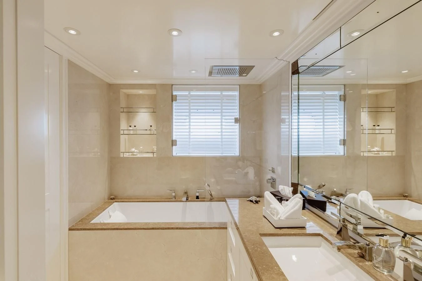 a bathroom with a large mirror aboard IDEFIX II Yacht for Charter