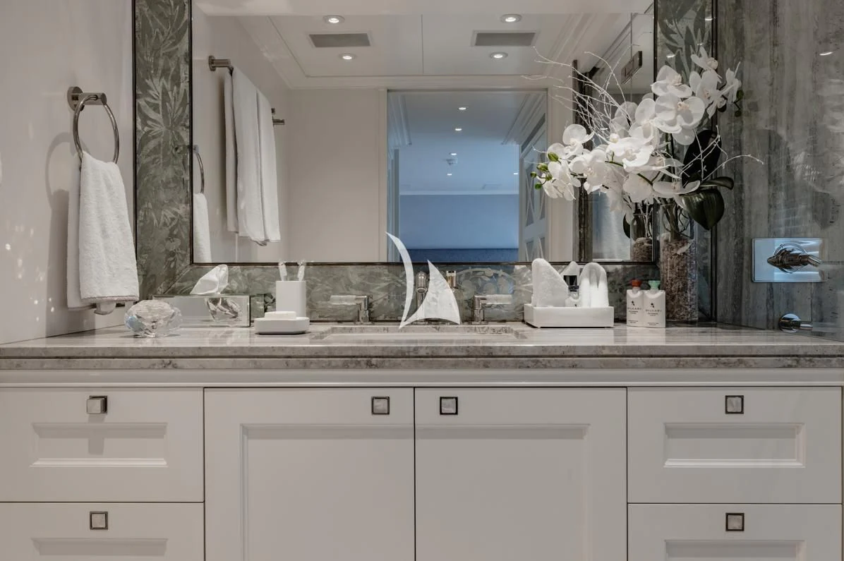 a bathroom with a large mirror aboard IDEFIX II Yacht for Charter