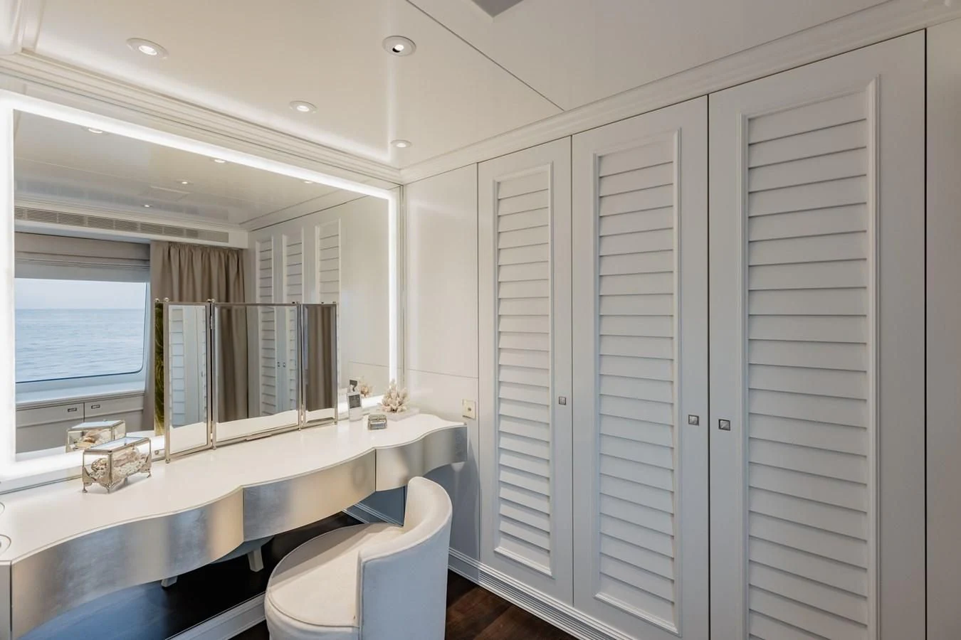 a bathroom with a large closet aboard IDEFIX II Yacht for Charter