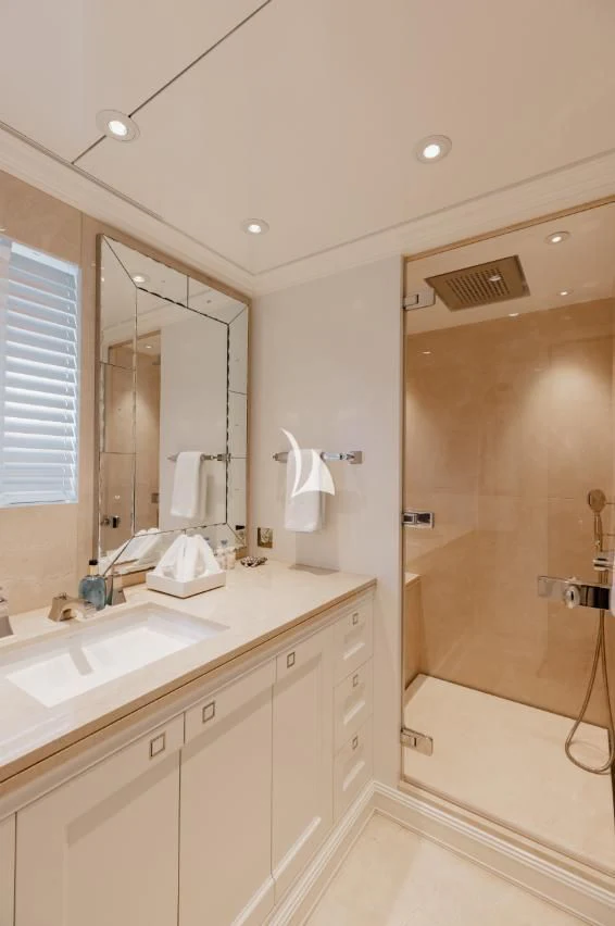 a bathroom with a shower and sink aboard IDEFIX II Yacht for Charter