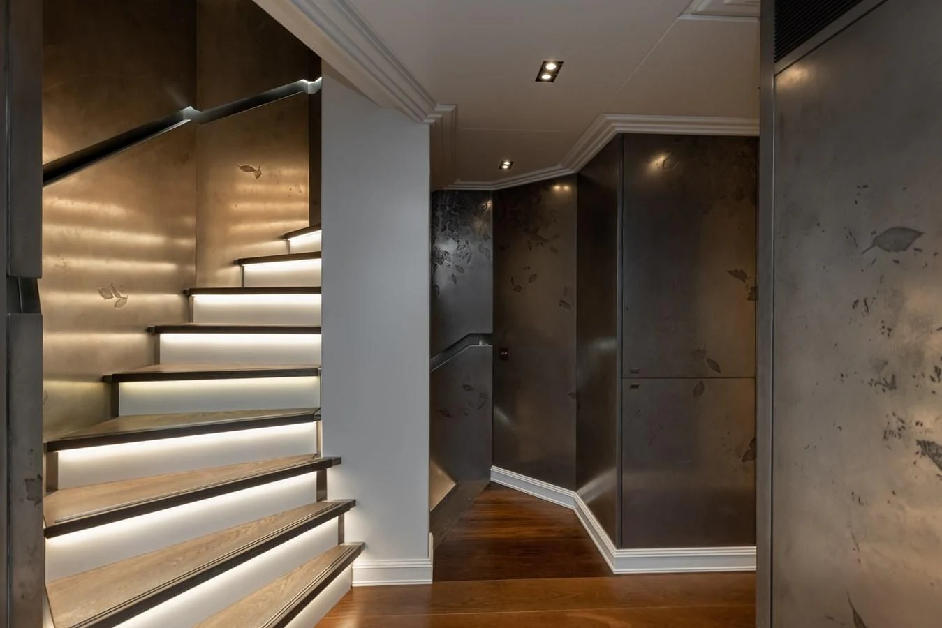 a room with a staircase and a large glass door aboard IDEFIX II Yacht for Charter