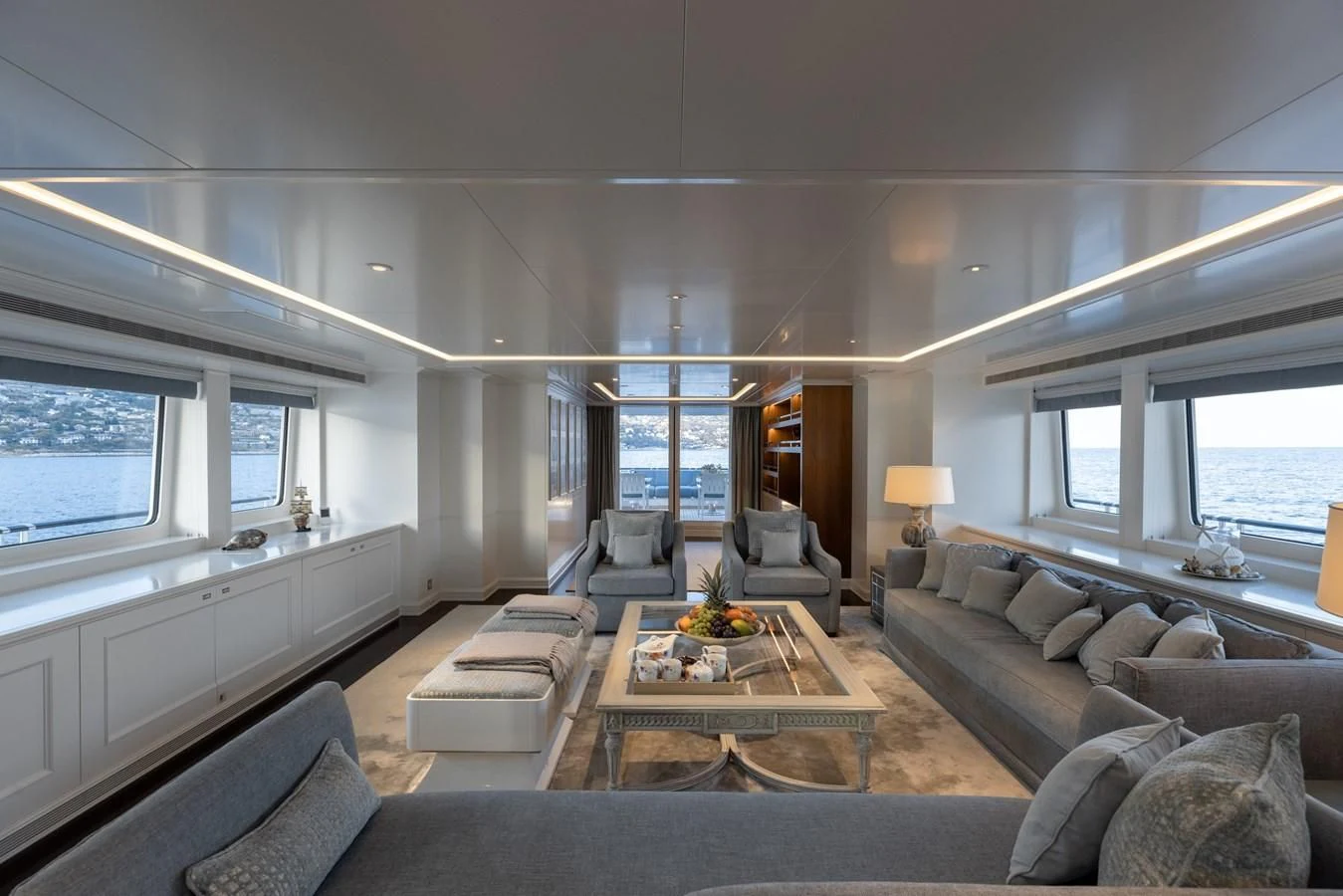 a living room with a large window aboard IDEFIX II Yacht for Charter