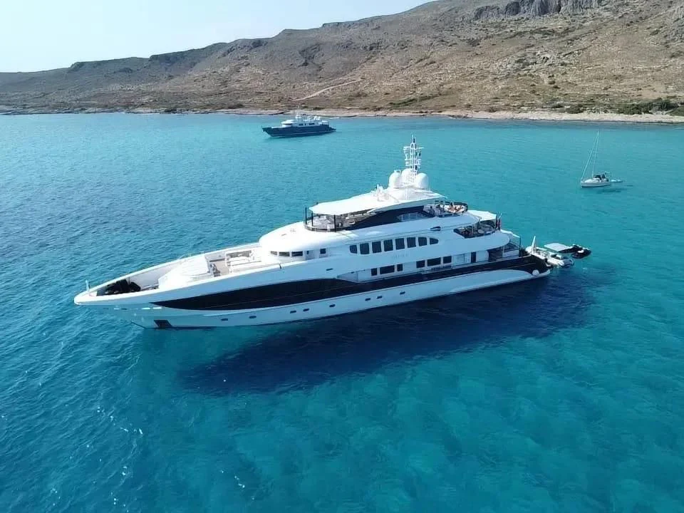 a large white boat in the water aboard IDEFIX II Yacht for Charter