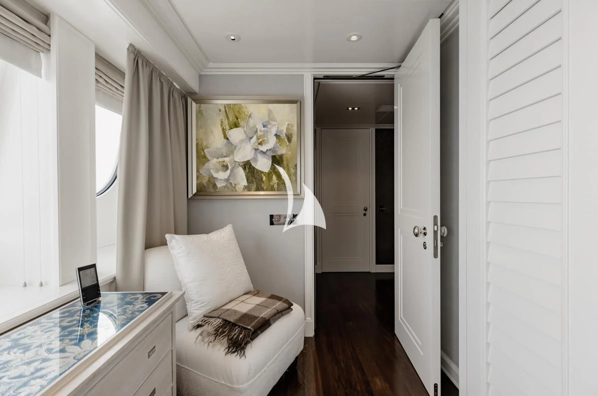 a room with a bed and a desk aboard IDEFIX II Yacht for Charter