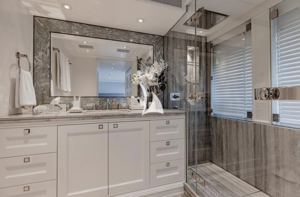 a bathroom with a sink and a mirror aboard IDEFIX II Yacht for Charter