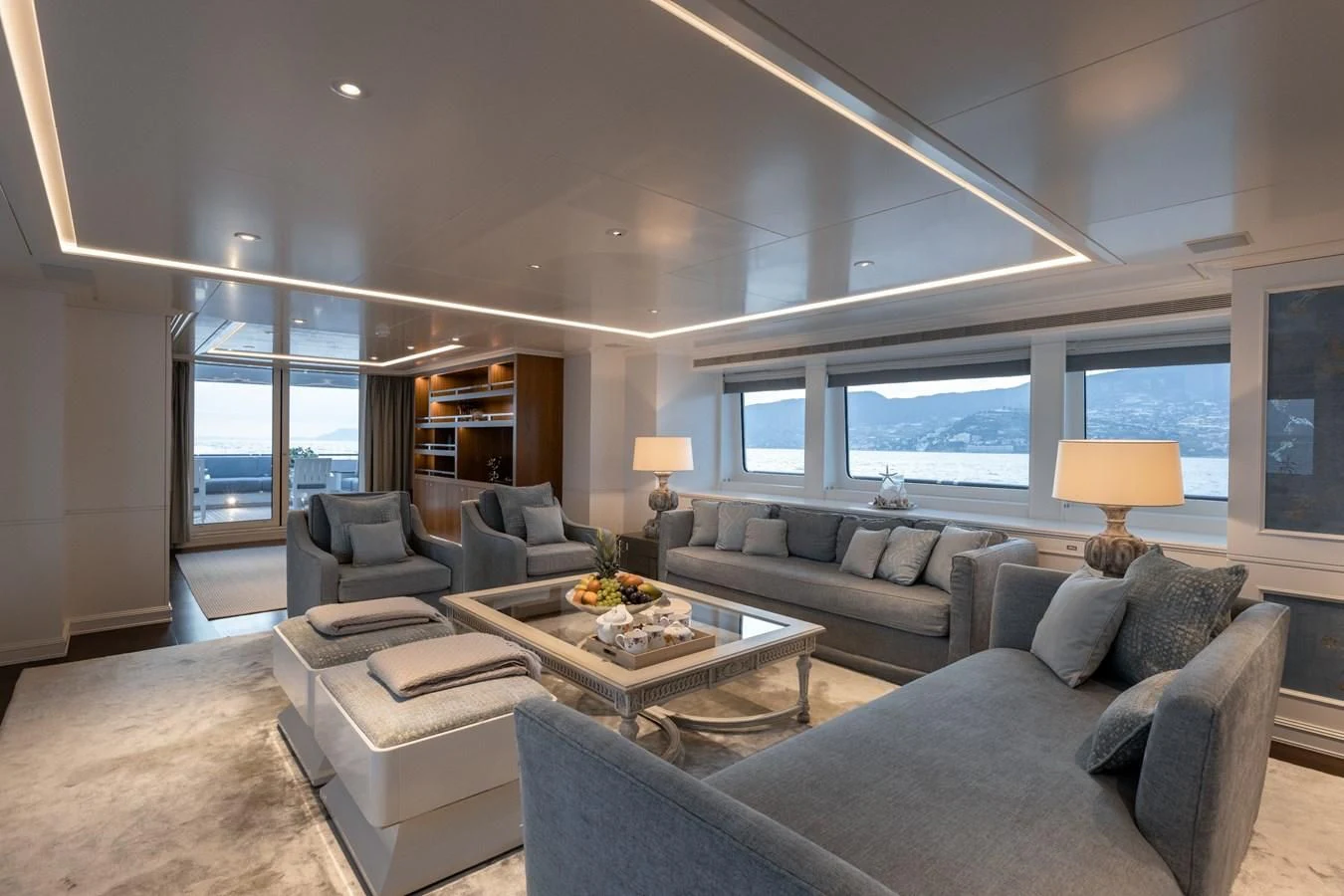 a living room with a large window aboard IDEFIX II Yacht for Charter
