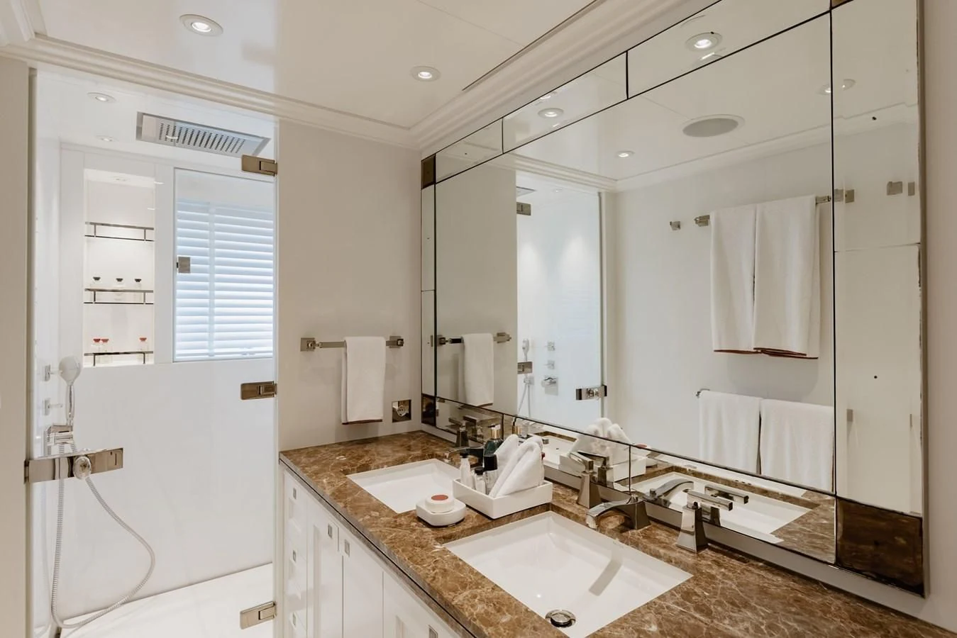 a bathroom with a large mirror aboard IDEFIX II Yacht for Charter