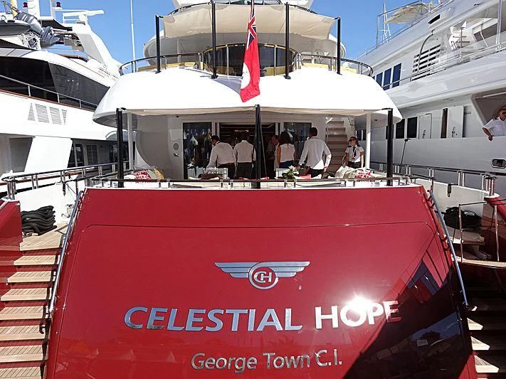 a boat with a red banner aboard IDEFIX II Yacht for Charter