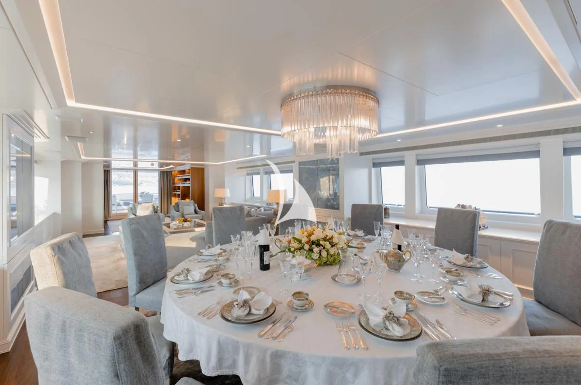 a dining room with a large table aboard IDEFIX II Yacht for Charter