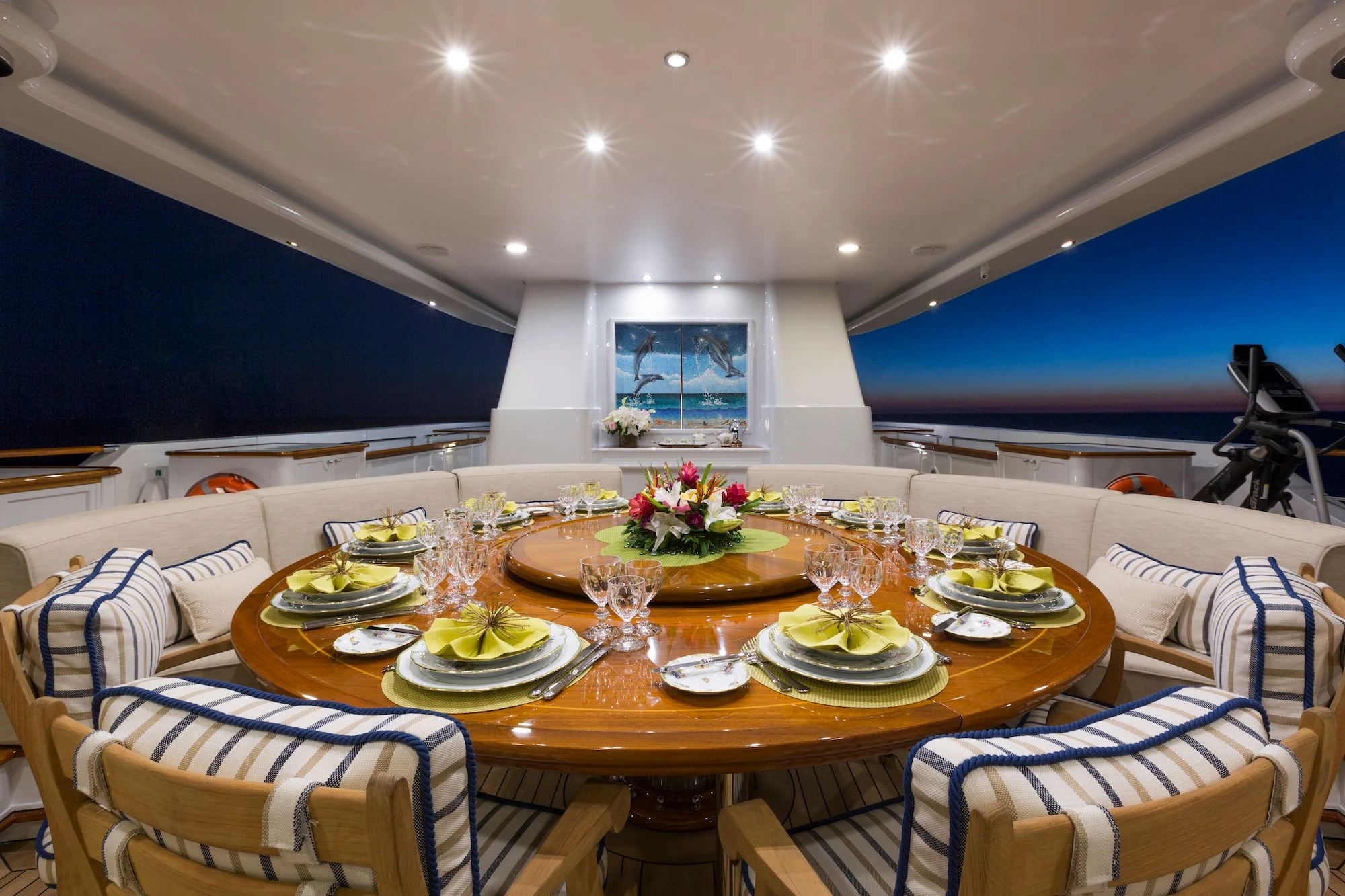a large table with plates and glasses aboard KATHARINE Yacht for Sale
