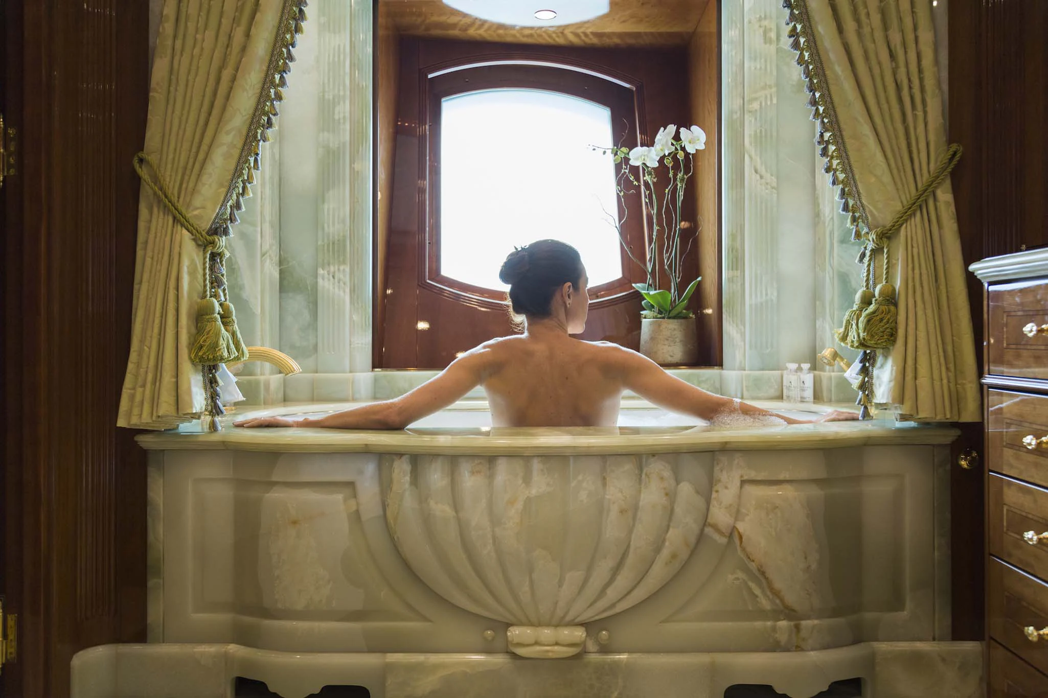 a person in a bathtub aboard KATHARINE Yacht for Sale