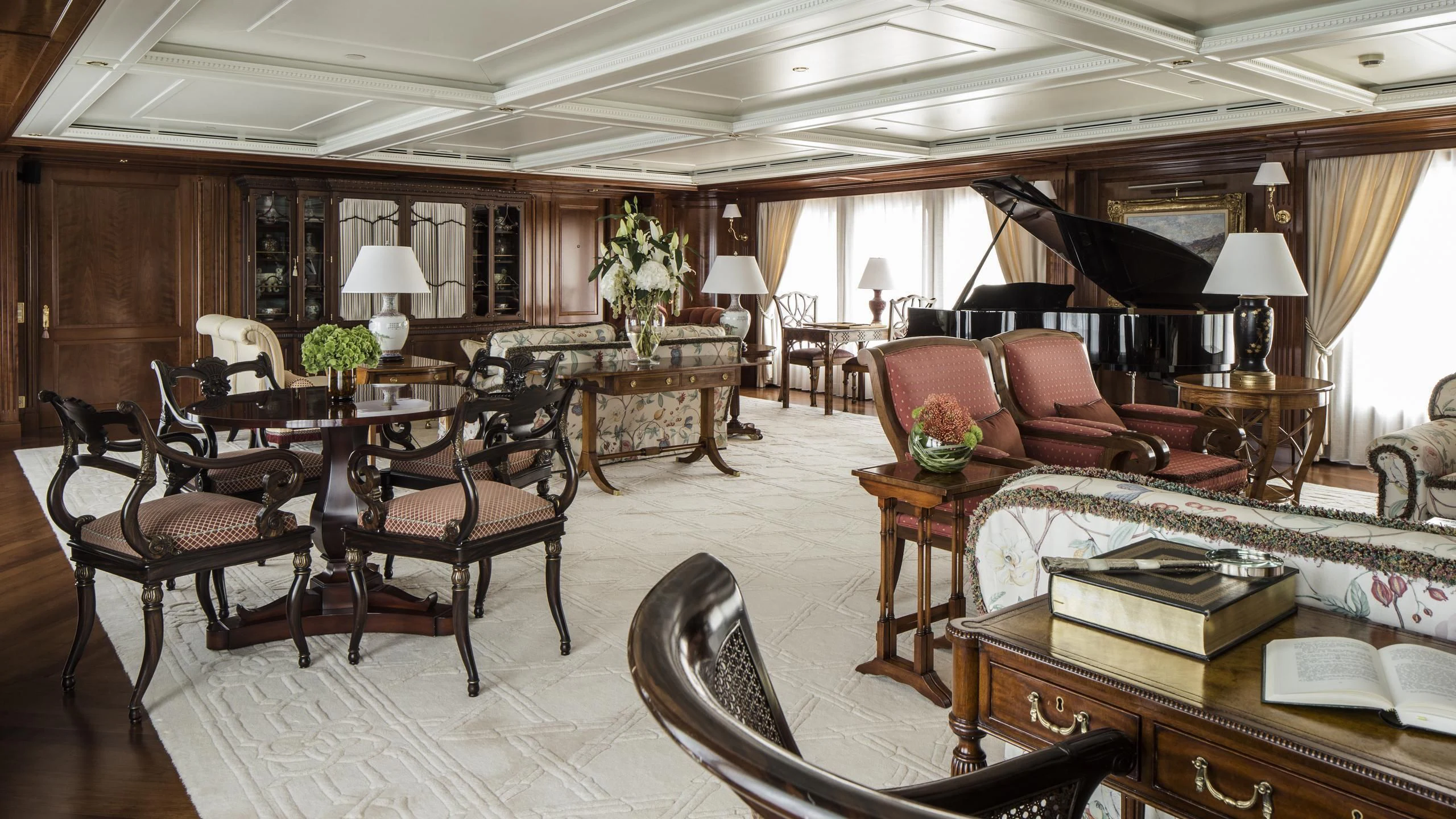 a large living room with a large table and chairs aboard KATHARINE Yacht for Sale