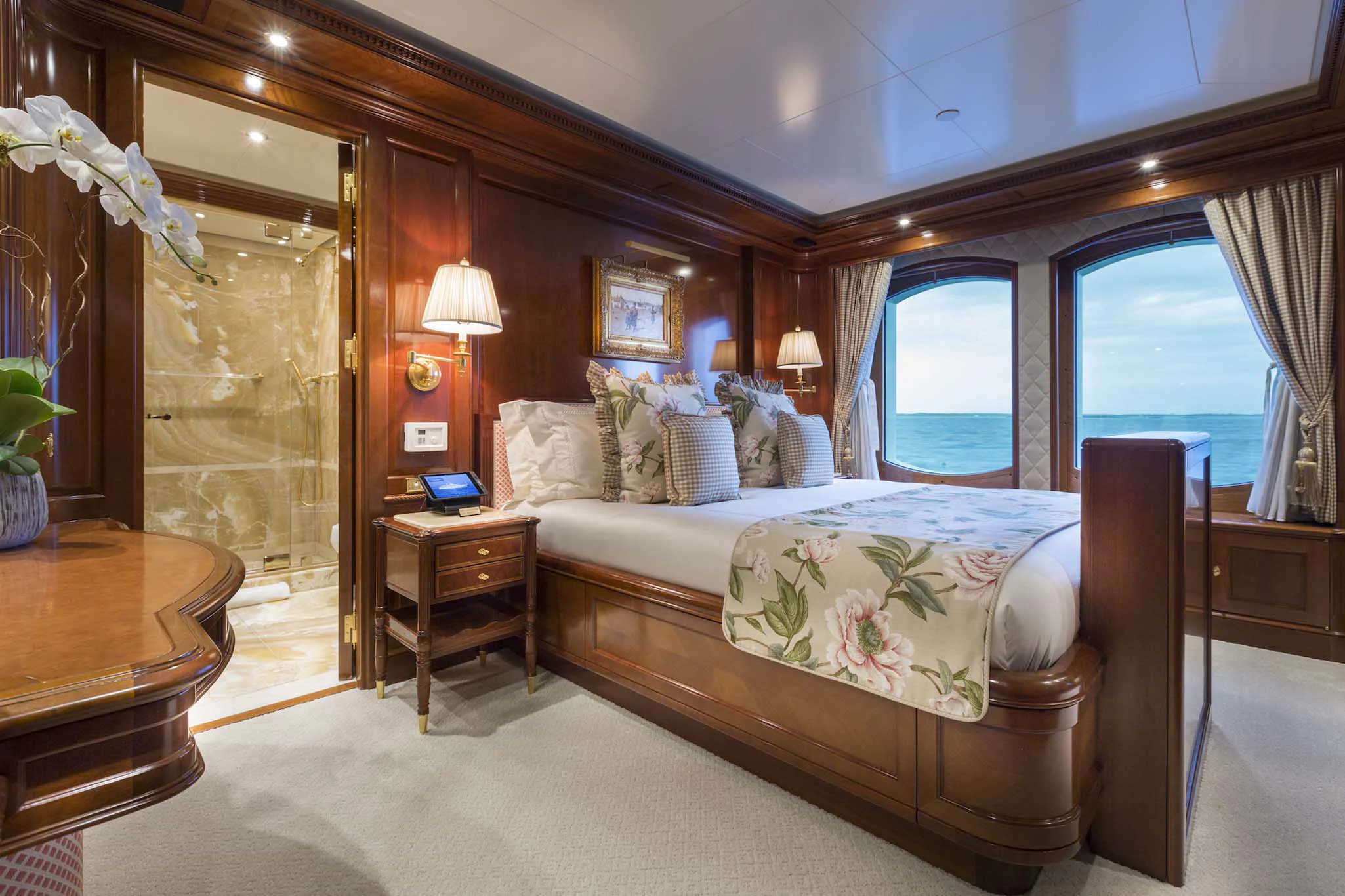 a bedroom with a bed and a window aboard KATHARINE Yacht for Sale