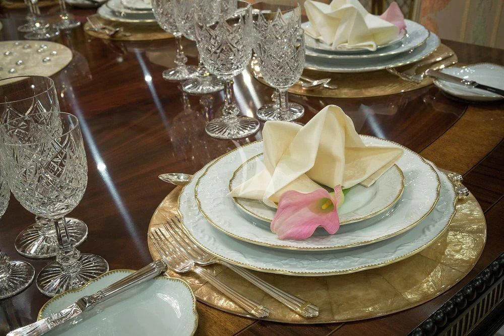 a plate of food and glasses aboard KATHARINE Yacht for Sale